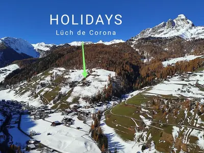 an aerial view of a ski resort in the mountains at Lüch de Corona in Frena
