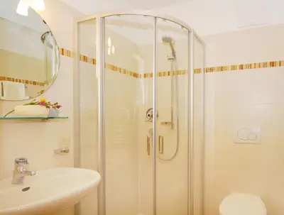 a bathroom with a shower and a sink at Singerhof in Castelrotto