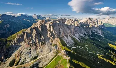 an aerial view of a mountain with a road at Alpin Hotel & Restaurant Frara in Selva di Val Gardena