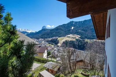 a bedroom with a large bed in a room at Apartments Raphael in Ortisei