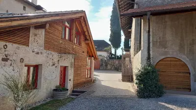 an alley in an old house with a wooden garage at Charmantes Ferienhaus in Eppan, Südtirol, ganzes Haus nahe Montiggler Badeseen und Bozen in Appiano sulla Strada del Vino
