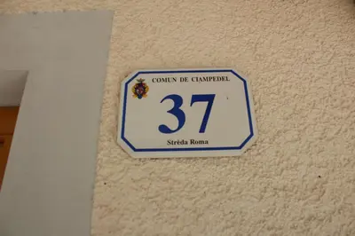 a sign on a wall with the on it at Cesa Anna in Campitello di Fassa
