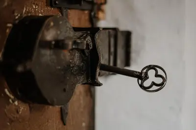 a metal door knob with a cross on it at der Paterhof- wohnen in historischen Mauern in Pianizza di Sopra