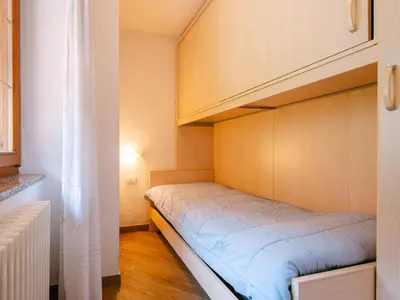 a small bedroom with a bunk bed in it at Apartment Appartamento Crepaz by Interhome in Canazei