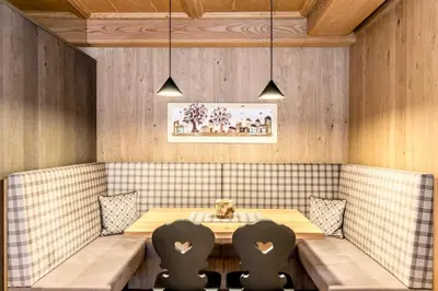 a buffet with different types of bread and pastries at Hotel Panorama in San Martino di Castrozza