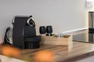 a coffee maker sitting on top of a counter at Ferienwohnungen Alber in Rablà