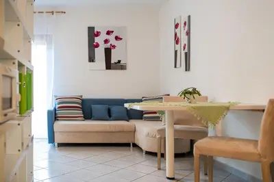 a living room with a couch and a table at Ferienwohnungen Alber in Rablà
