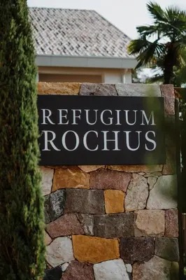 a sign for a hotel in front of a building at die Waltraud im Refugium Rochus in Pianizza di Sopra