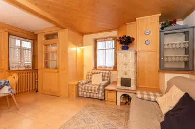 a living room with a couch and a chair at Casa Soreje in Mazzin