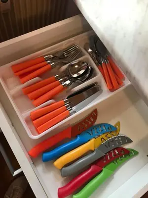 a drawer filled with lots of colorful utensils at Appartamento Bolzano - Vittorio Veneto - Parcheggio incluso in Bolzano