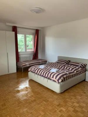 a bedroom with two beds in a room at Appartamento Bolzano - Vittorio Veneto - Parcheggio incluso in Bolzano