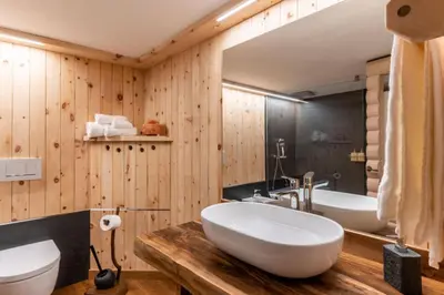 a bathroom with a large white sink and a tub at Chalet alla Perla, Grumes in Grumes