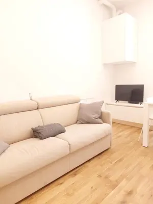 a white living room with a white couch at Apartment Ca' de Bezzi in Bolzano