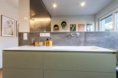 a bathroom with a sink and a counter at Mali Apartments Garden Suite in Tirolo