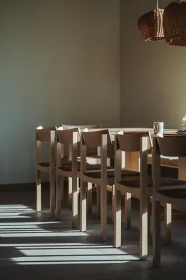 a dining room with a table and chairs at Schnitzbichlhof in Lana