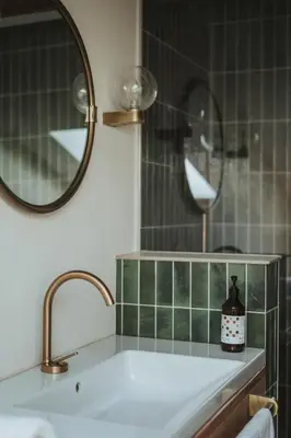a bathroom with a sink and a mirror at Schnitzbichlhof in Lana