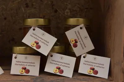 a group of three jars of jam with labels on them at Pignathof Castanea in Campodazzo
