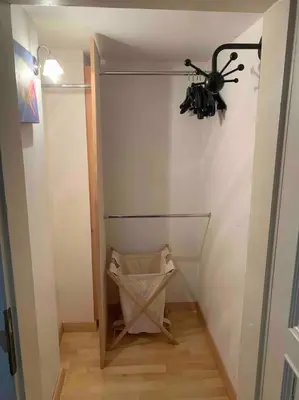 a room with a hallway with a fan on the wall at Helles Apartment in historischer Villa in Merano