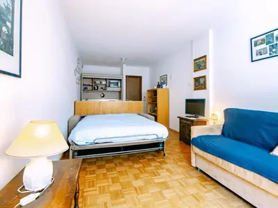 a large white building with snow on the ground at Apartment Solaria-2 by Interhome in Campestrin