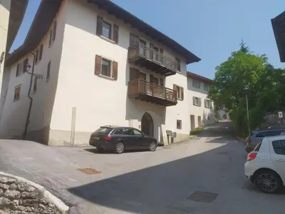 a car parked in front of a building at APPARTAMENTO TOMA MIHAELA in Tres