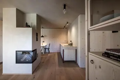 a small apartment with a kitchen and a living room at Rappersbühl in Collalbo