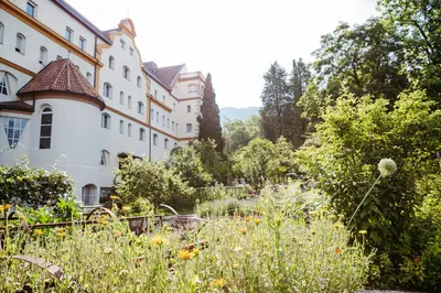 a garden in front of a building at Gästehaus Salvatorianerinnen in Merano