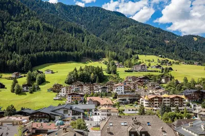 an aerial view of a village in the mountains at Garni Rives in Ortisei