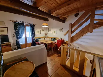 a room with a table and a dining room at El Fienil in Mazzin