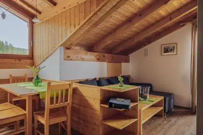 a living room with a table and a couch at Mandlerhof in Verano