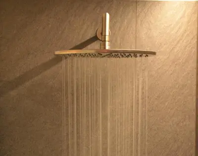 a shower with a shower head in a bathroom at Kastelart - Karbon in Castelrotto