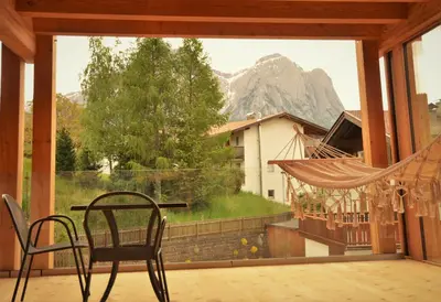 a room with a large window with a view of a mountain at Kastelart - Karbon in Castelrotto