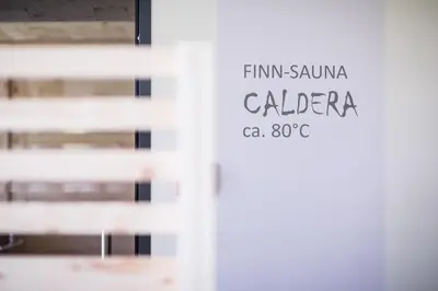 a sign on the door of a building at Pension Hasslhof in Caldaro