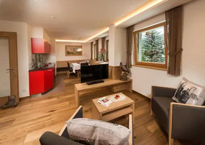 a living room with a couch and a table at Alpin Sport in Ortisei