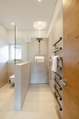 a bathroom with a shower and a sink and a toilet at Ferienhaus im Grünen in Terlano
