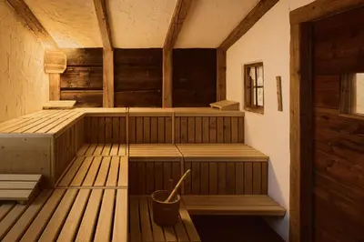 a room with a sauna with a bucket in it at Residence Rosarela in Badia