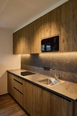 a kitchen with a sink and a microwave at Residence Rosarela in Badia
