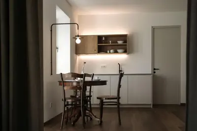 a dining room with a table and some chairs at Kaiserau-Höfl in Bolzano