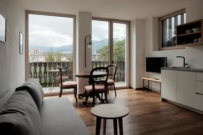 a living room with a couch and a table at Kaiserau-Höfl in Bolzano