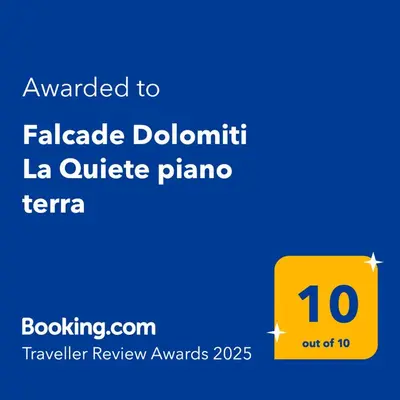 a yellow sign with the number on it at Falcade Dolomiti La Quiete piano terra in Fregona