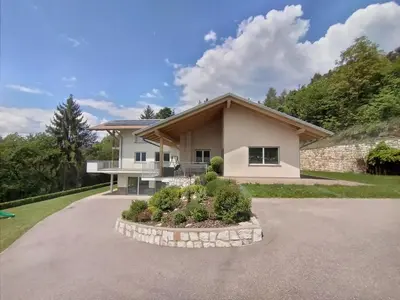 a large white house with a driveway at Ciasa Erica - Val di Non in Predaia