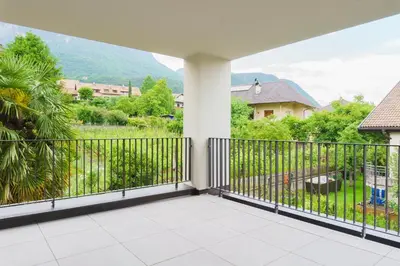 a balcony with a view of a yard at Auszait Apartments 1 in Caldaro
