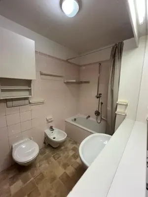 a bathroom with a toilet and a sink and a tub at Gardena SudTirol Gianni's Home in Santa Cristina in Val Gardena