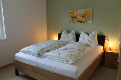 a bed with pillows on it in a bedroom at Gartnerhof in Plaus