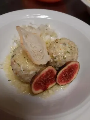 a plate of food with meat and blood figs at Albergo Scoiattolo in Tret