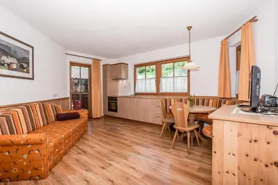 a living room with a couch and a table at Leishof in Villandro