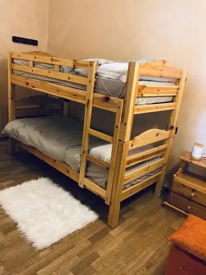 a couple of bunk beds in a room at Appartamento El Feudo in Tesero