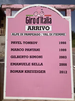 a sign for a restaurant with a list of prices at Appartamento El Feudo in Tesero