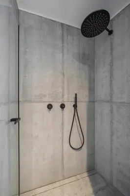 a shower with a shower head in a bathroom at Villa Rames in Ortisei