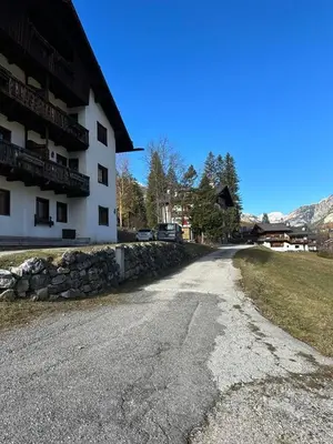 an empty road in front of a building at Appartamento Crignes in Cortina dʼAmpezzo