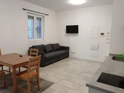 a living room with a couch and a table at Apartaments and Rooms Claudia Augusta in Bolzano